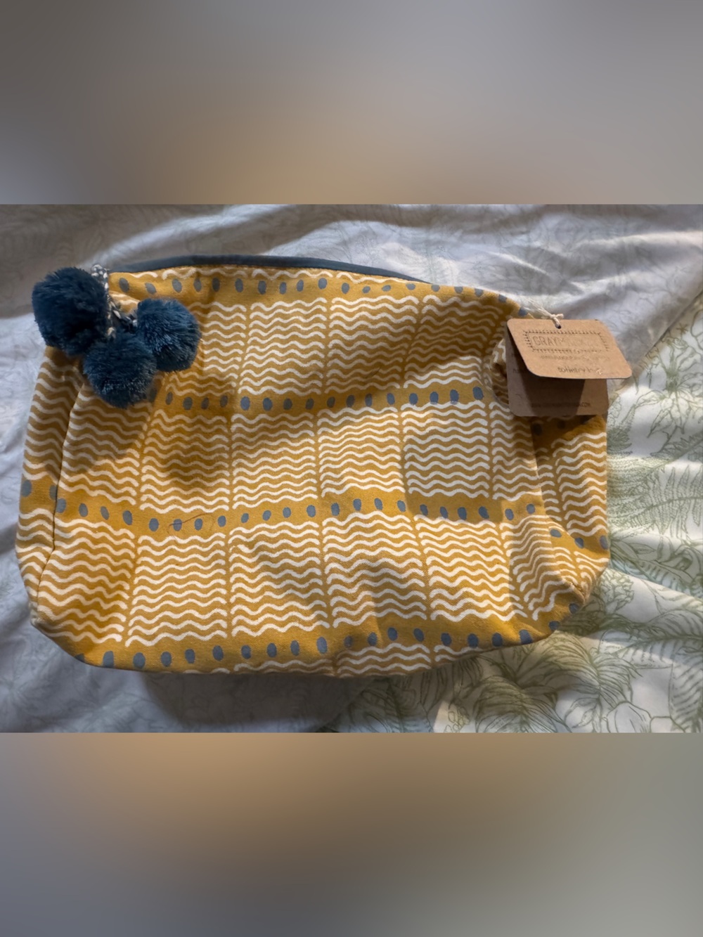 Mustard Yellow Patterned Travel Pouch with Navy Pom-Pom